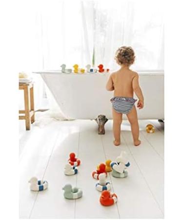Oli & Carol FLO The Floatie Navy | Natural Rubber Float for Imaginative Play - Buy Online on SooperMarket.com