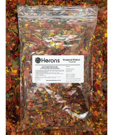 HERONS - Tropical Flakes - For all Tropical Fish - Guppies Bettas Neons Cichlids Angelfish Swordtails - Multi-Nutrient Complex - Supports Growth Colouration and Immune System - 100 Grams Fish 100 g (Pack of 1)