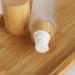 Cosidea 100ml Refillable Bamboo Lid Glass Bottles | Lotion Pump & Travel Containers for Cosmetics - Buy Online on SooperMarket.com
