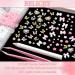 BELICEY 1000PCS 3D Nail Charms - Cute Butterfly Bow Star Heart & Moon Designs for Nail Art DIY - Includes Picker Pencil & Tweezer - Pink & White Flower Collection - Buy Online on SooperMarket.com